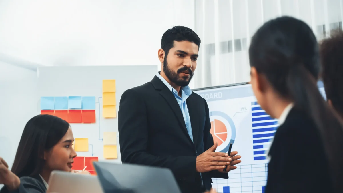 Leadership coach helping team solve issue