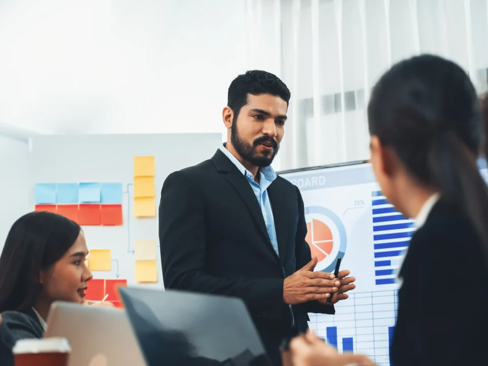Leadership coach helping team solve issue